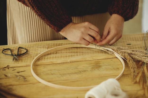 hands embroidering thread